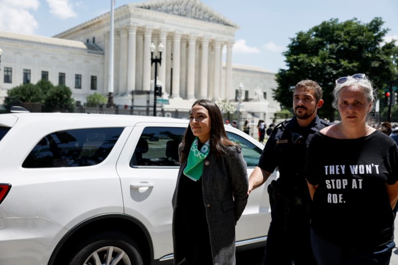 Alexandria Ocasio Cortez slammed for pretending to be handcuffed during arrest at abortion rights rally