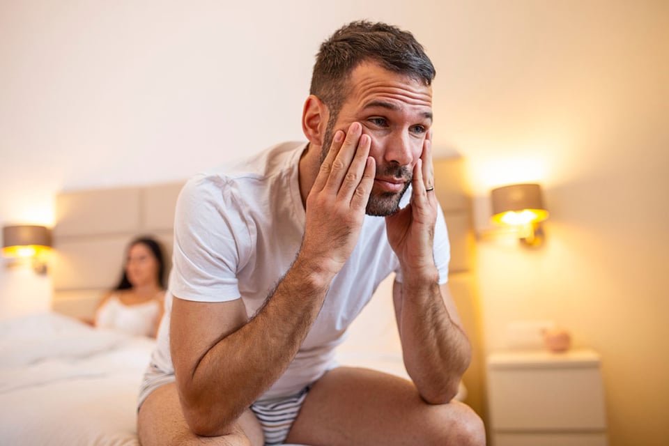 couple in bed, sexual problem, upset man